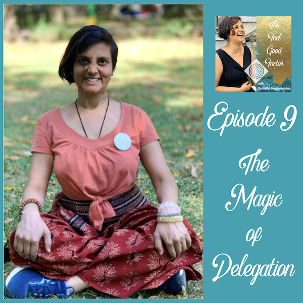 Susmitha Veganosaurus sitting cross-legged on the grass. Facing camera with a smile. Palms resting on knees. The Feel Good Factor Podcast. Episode 9. The Magic of Delegation. A podcast episode about the extreme importance of delegation.