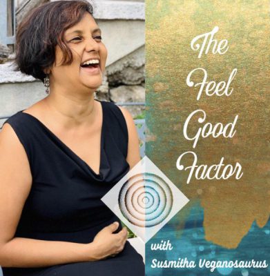 The Feel Good Factor with Susmitha Veganosaurus. Susmitha in a black dress, laughing with joy. Indian podcast in English.