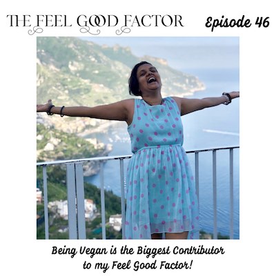 The Feel Good Factor episode 46. Happy woman in summer dress with short hair. Arms spread wide, head thrown back in laughter. Being Vegan is the Biggest Contributor to my Feel Good Factor!