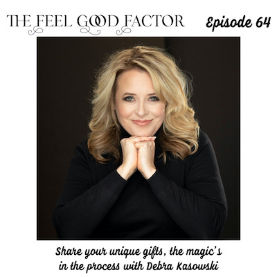 The Feel Good Factor, episode 64. Blond lady in a black full sleeved top, fists casually bunched together under her chin, smiling at the camera. Black background. Share your unique gifts, the magic’s in the process with Debra Kasowski