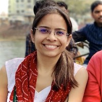 Smiling India girl wearing glasses. Ekta Minocha. The Vegan Birdie.