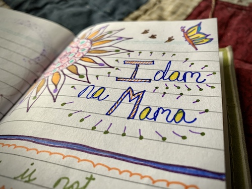 Close up of hand drawn doodles and Zentangle art with the words “Idam na Mama” handwritten to one side.