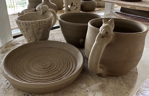 Close up view of handmade terracotta pieces during the pottery workshops at Dharamkot Studio