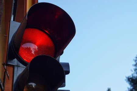 Close up of red signal light. Traffic rules.