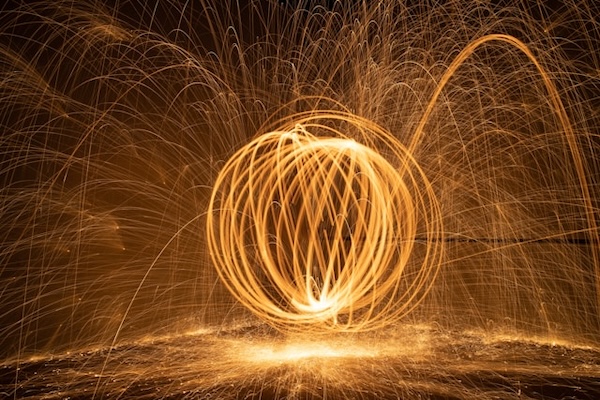 Strands of golden, spinning light. forming a ball.